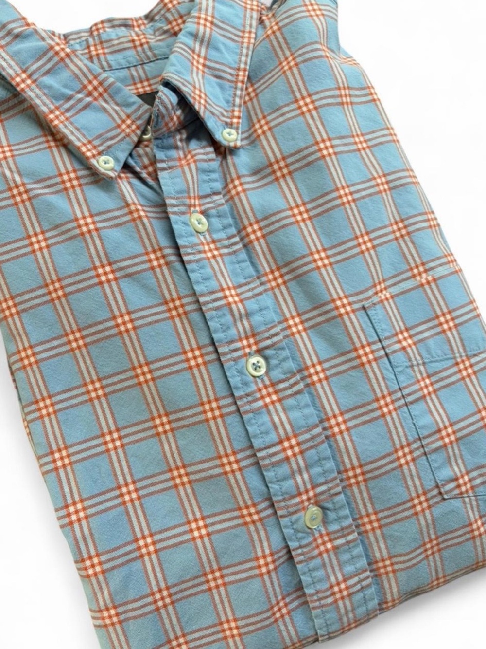 Eddie Bauer men’s XL sky blue and orange plaid button up shirt. 100% cotton.